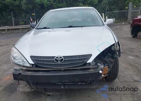 2003 Toyota Camry Le z USA, uszkodzony, nr VIN 4T1BE32K13U687928